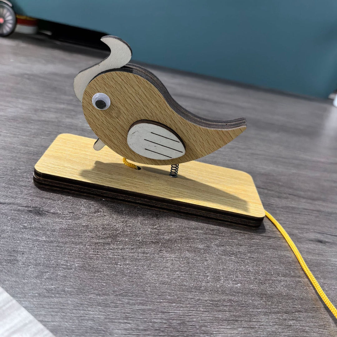 Unisex nan movable wooden bird table figure made of plywood with spiral spring and pull line Kalsten