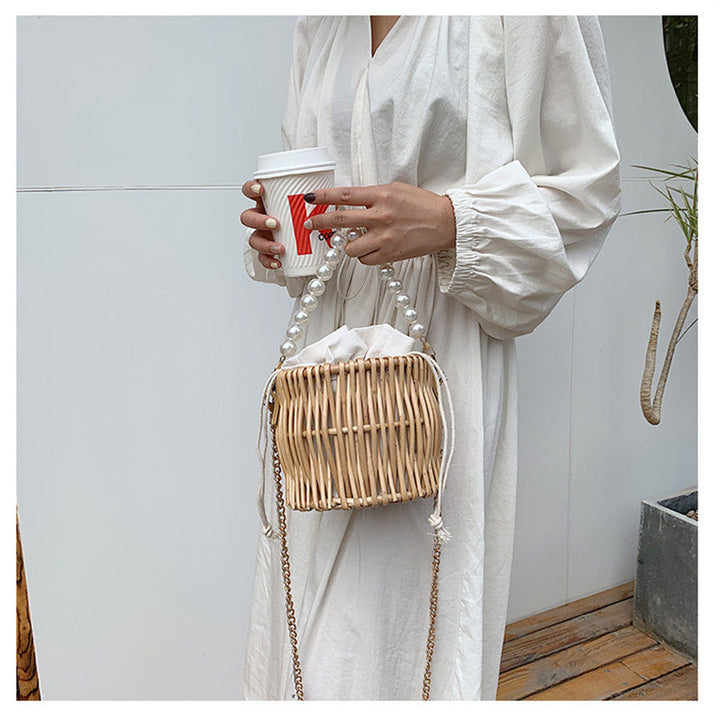 Women’s handbag with elegant pearl handle and braided design Kalsten
