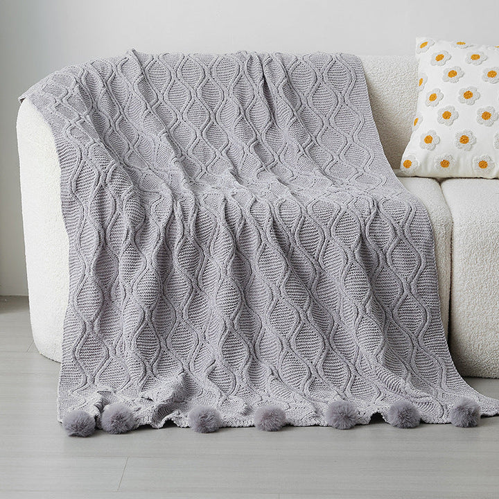 Ladies knit blanket with decorative pom poms Kalsten