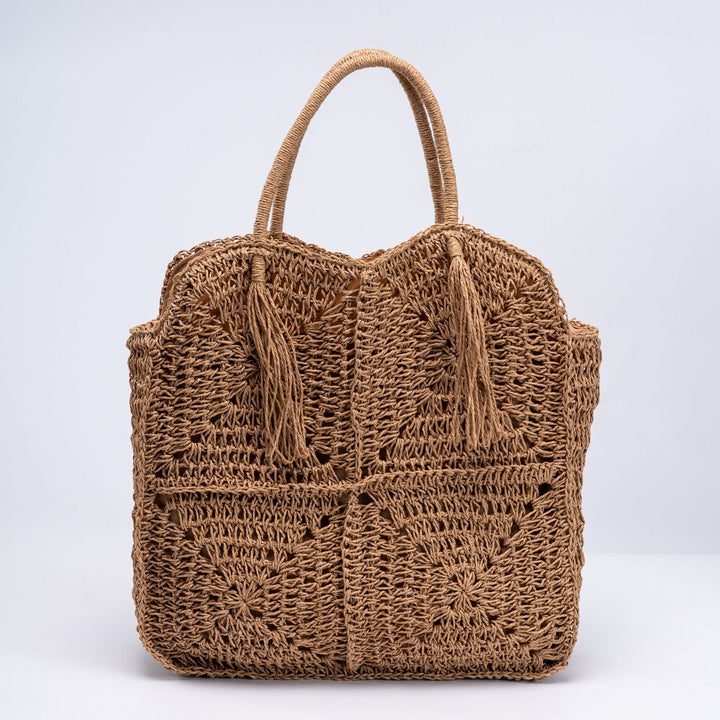 Handcrafted straw beach bag with decorative fringes Kalsten