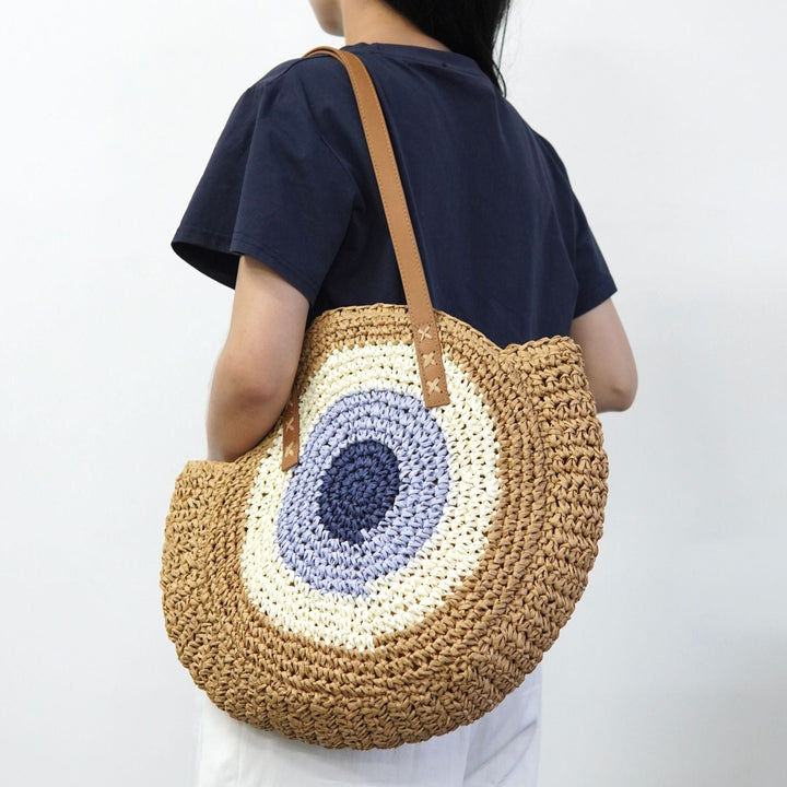 Braided basket bag with unique round design and elegant shoulder straps Kalsten