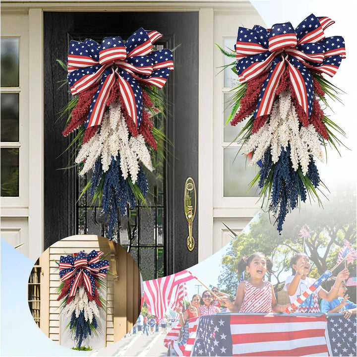 Independence Day tapering teardrop door swag with wired stars-and-stripes bow and textured faux floral sprays Kalsten