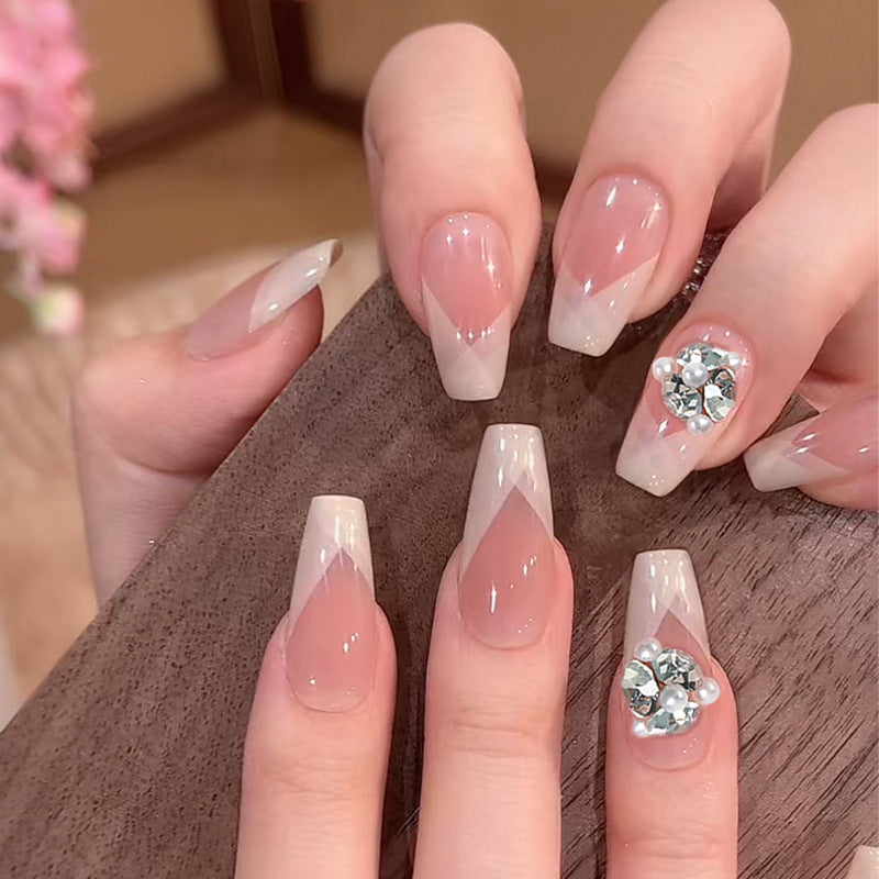 Artificial nail set with filigree tip designs and glamorous rhinestone accents Acalora