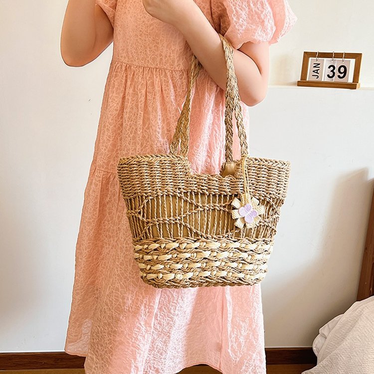 Handwoven beach bag with floral accents Kalsten