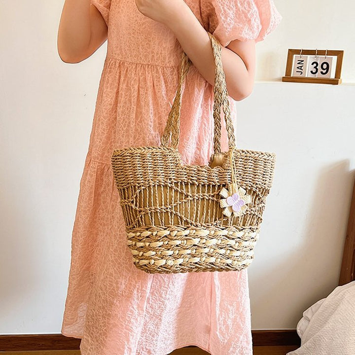 Handwoven beach bag with floral accents Kalsten