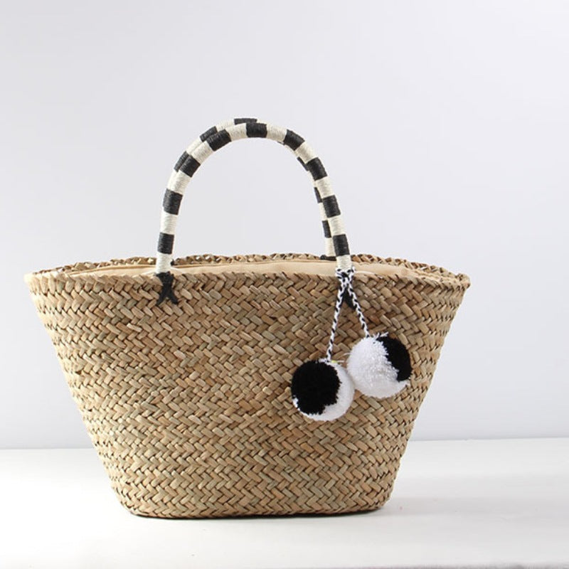 Braided beach bag with decorative pompons Kalsten