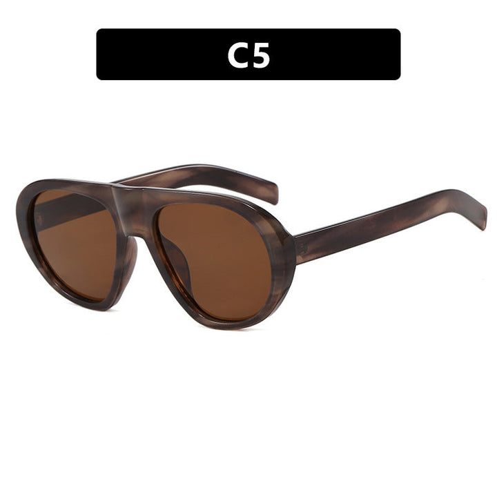 Women striking sunglasses with futuristic frame and sturdy design Kalsten