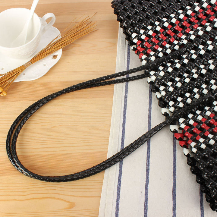 Stylish handbag made of braided material Kalsten