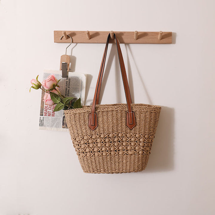 Handcrafted rattan basket bag with elegant leather accents Kalsten