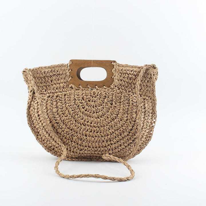 Handbag made of hand-woven natural material with stylish wooden handle Kalsten