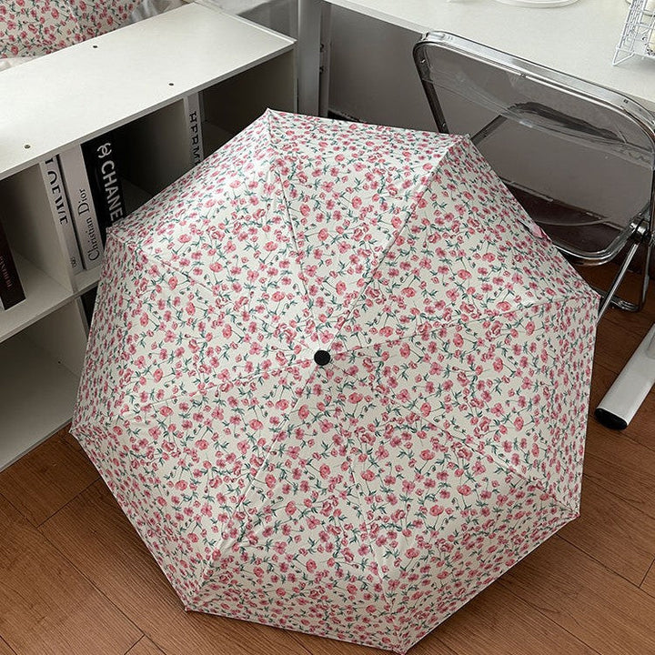 Women's folding umbrella with floral design and practical storage system Kalsten