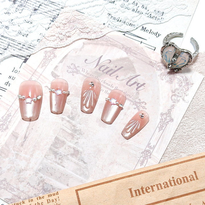 Exquisite artificial nails with glitter and pearl accents Kalsten
