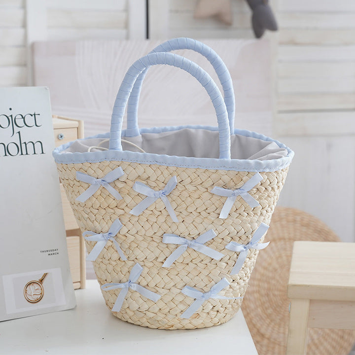Basket bag with delicate bows and padded edge Kalsten