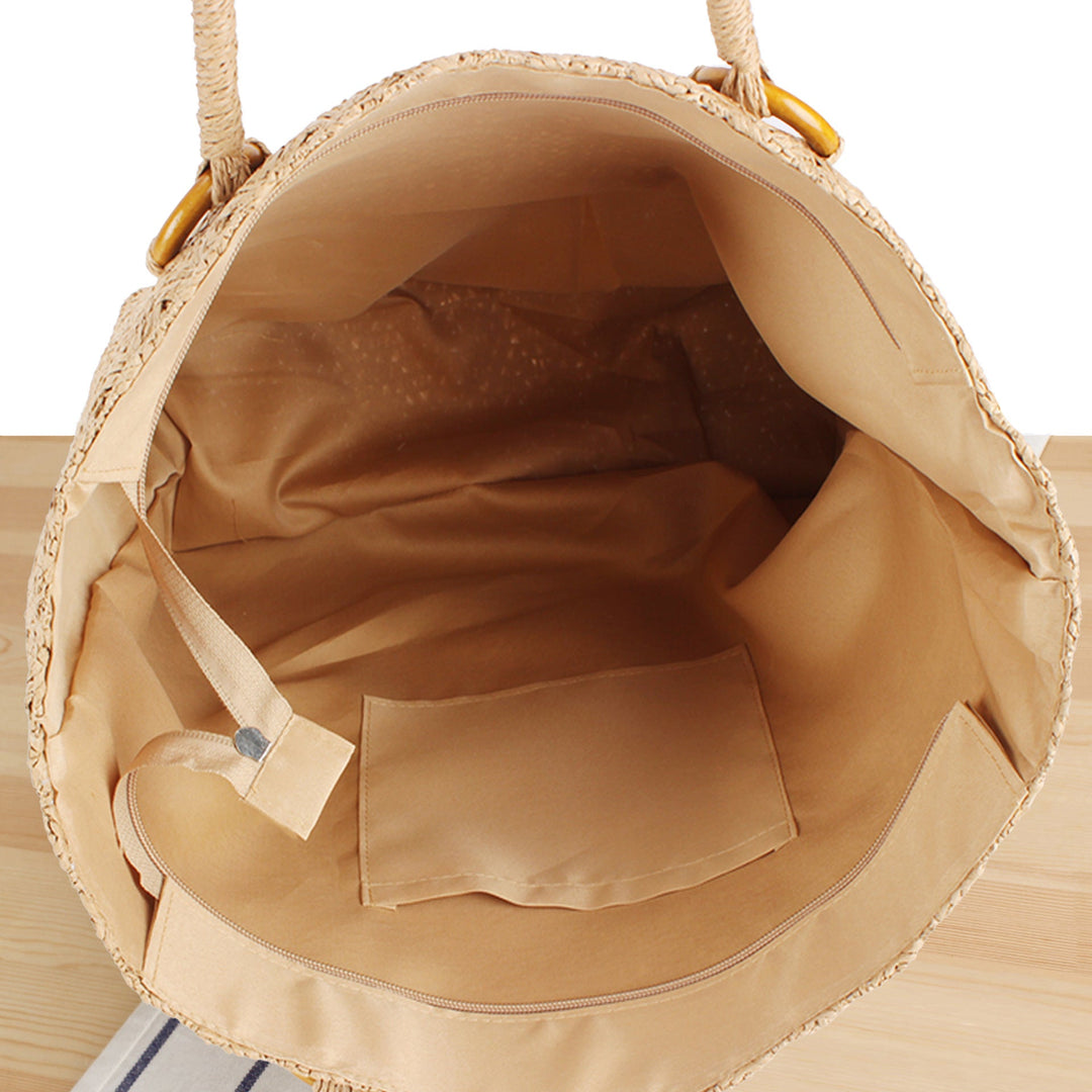 Beach bag made of natural woven material with sturdy carry handles Kalsten