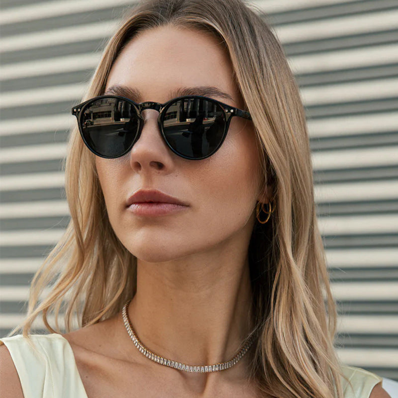 Women's fashionable round sunglasses with transparent frame and UV protection Kalsten