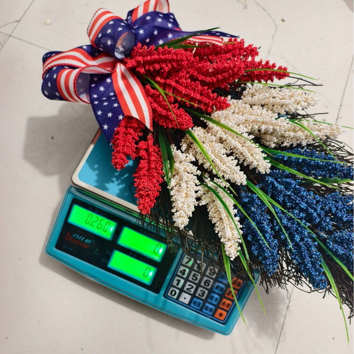 Independence Day tiered faux wildflower door swag with grosgrain stars-and-stripes bow Kalsten