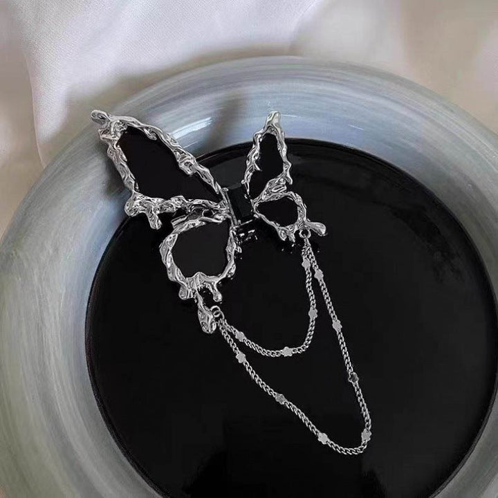Elegant brooch with flower and chain motif Kalsten