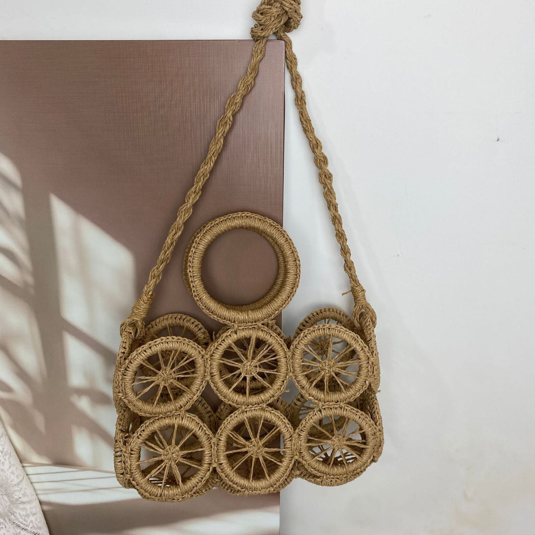 Artisan woven basket bag with striking wheel pattern Kalsten