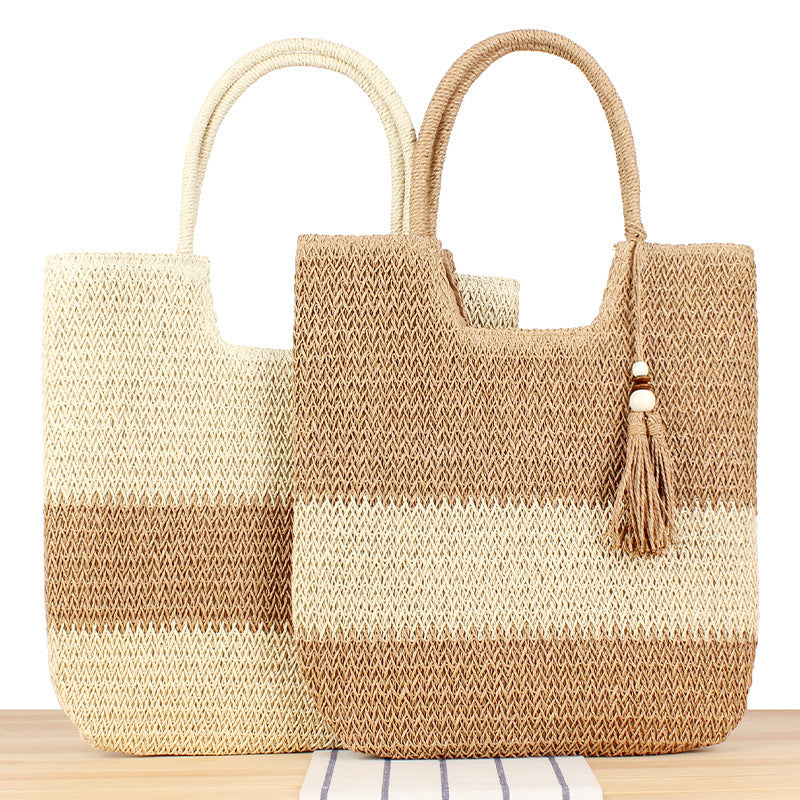 Fashionable beach tote bag made of woven natural material with fringed detail Kalsten