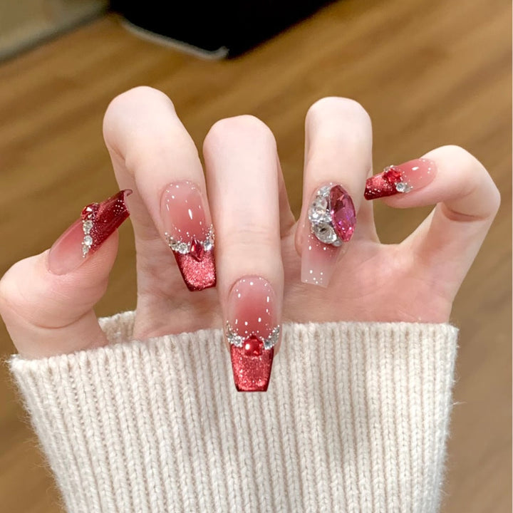 Glamorous artificial nails with sparkling rhinestone applications Kalsten