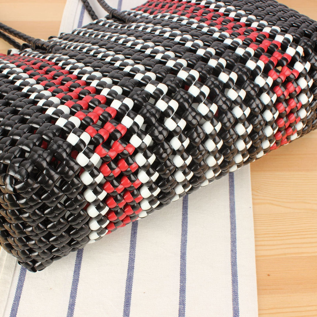 Stylish handbag made of braided material Kalsten