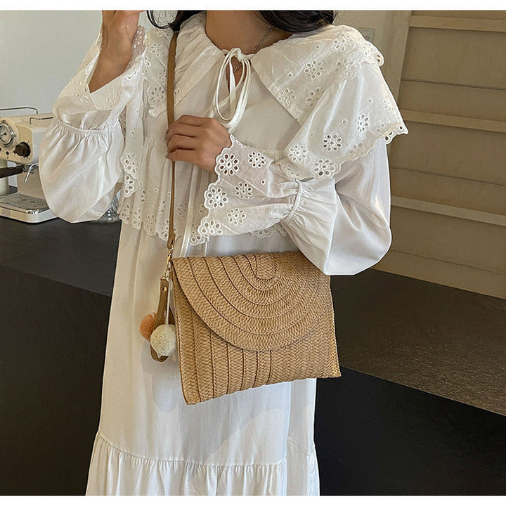 Braided shoulder bag with creative pom poms Kalsten