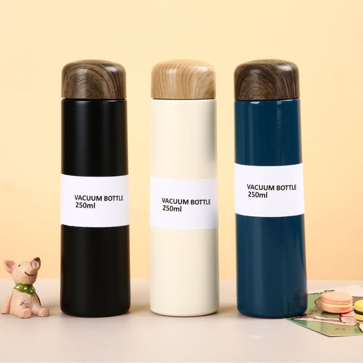 Women vacuum-insulated water bottle with innovative wooden lid Kalsten