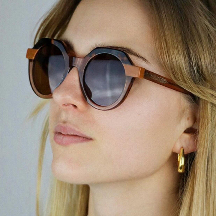 Ladies extravagant round sunglasses with colored accented frame Kalsten