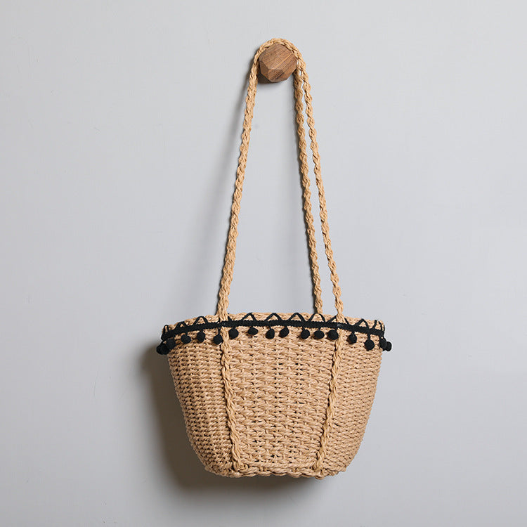 Delicate beach bag with pompons Kalsten