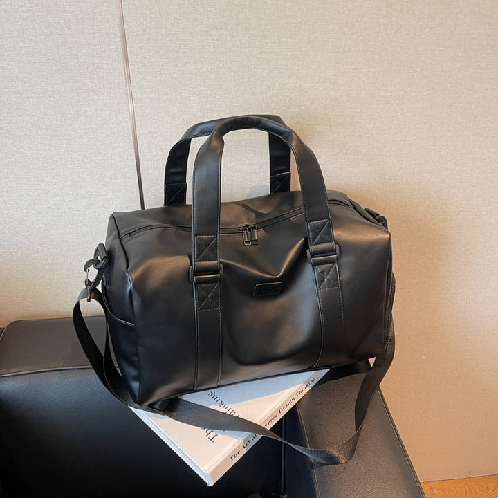 Sporty duffel bag with durable water-repellent material and versatile carrying options Kalsten