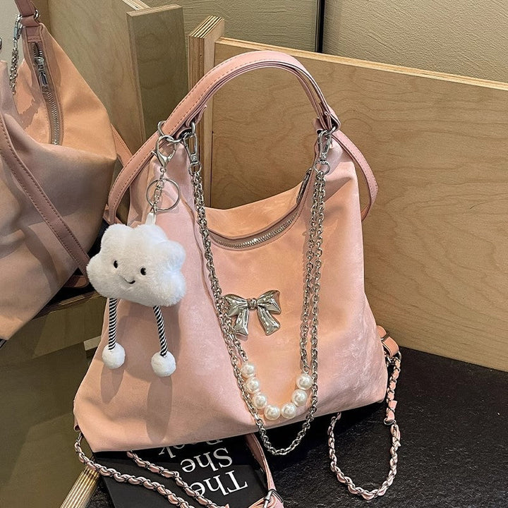 Fashionable handbag with unique pendant and chain accents Kalsten