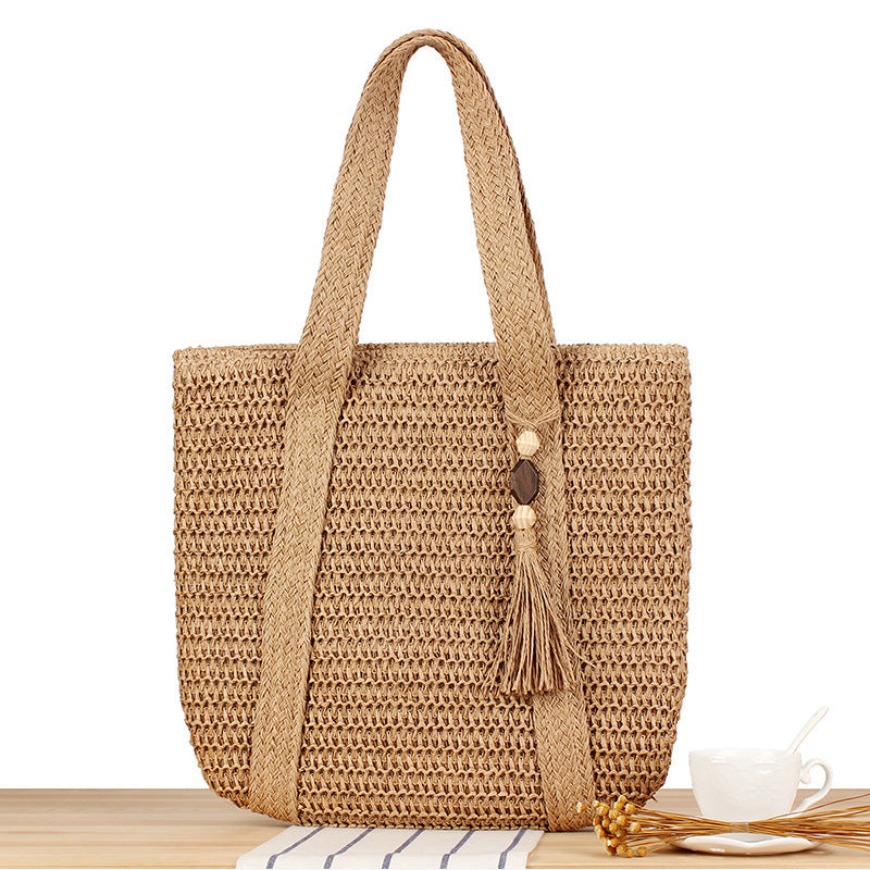 Eco-friendly straw tote bag with elegant tassel detail Kalsten