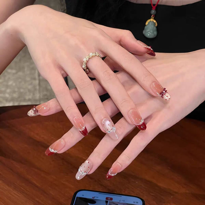 Artificial nails with glitter and tip accents Kalsten