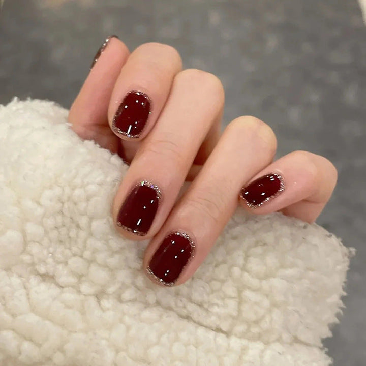 Glamorous artificial nails with heart design and glittering accents Kalsten