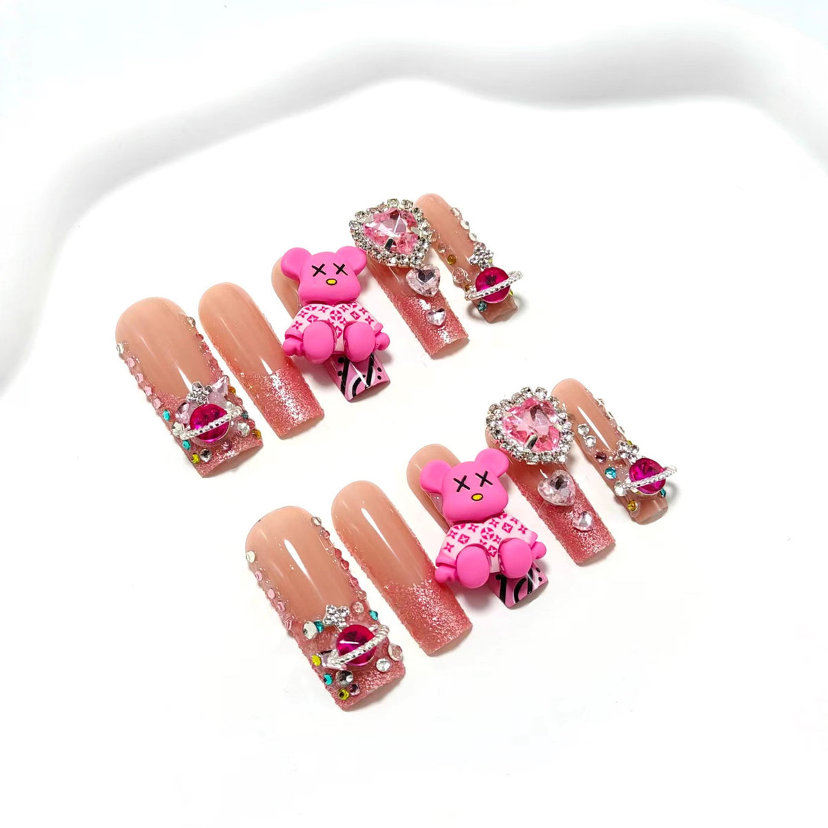 Artificial nail set with playful character motifs and glitter details Acalora