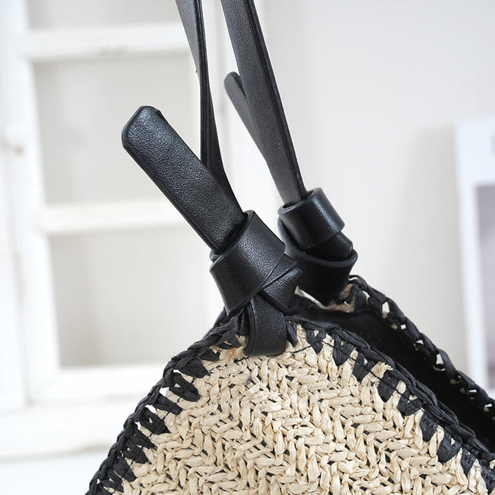 Handbag made of braided natural material with contrasting leather handles Kalsten
