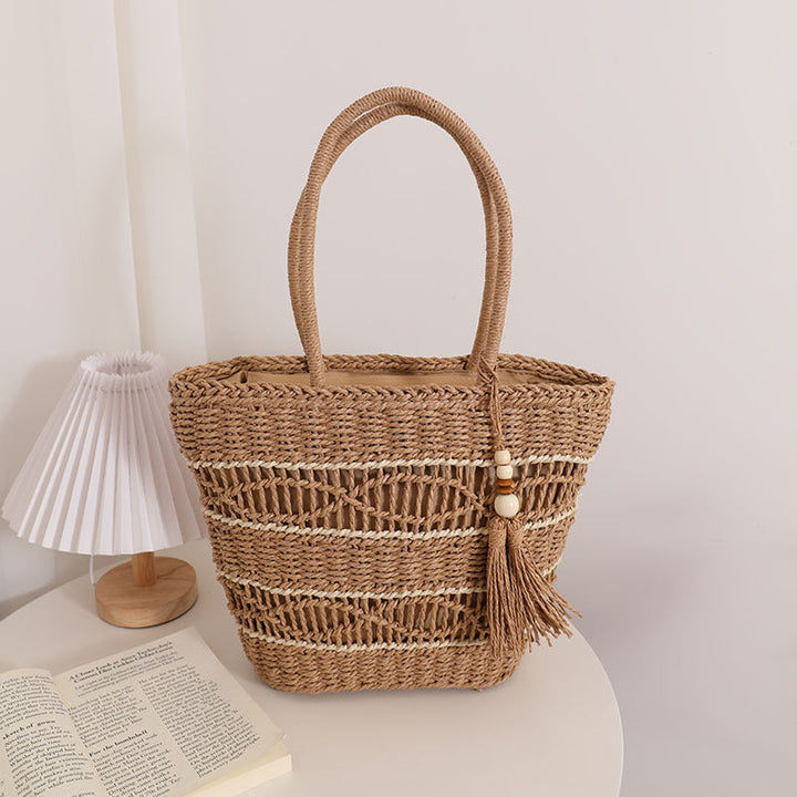 Handcrafted straw tote bag with decorative tassel detail Kalsten