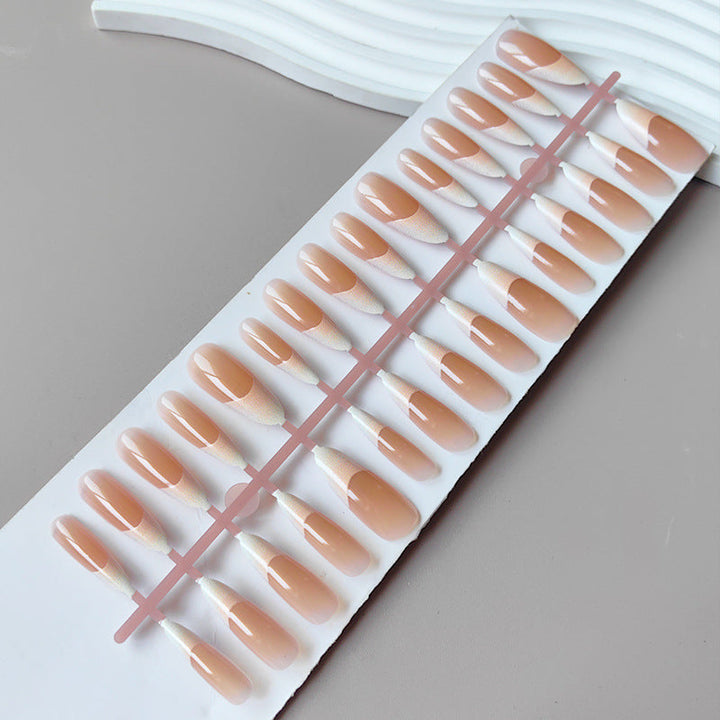 Artificial nails in the elegant French tip design Kalsten
