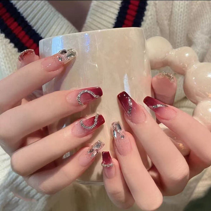 Glamorous artificial nails with heart-shaped accents Kalsten