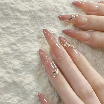 Artificial nail set with elegant ombre effect and glamorous embellishments Acalora