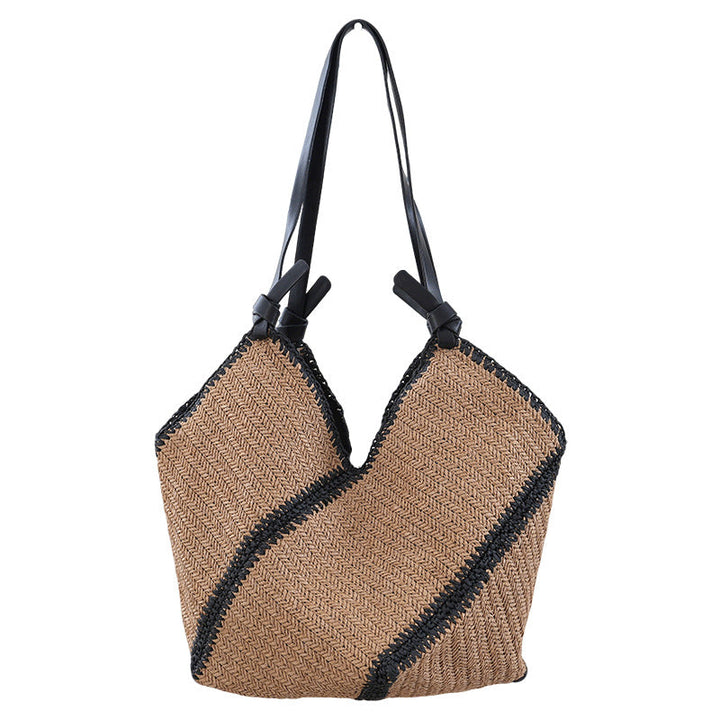Handbag made of braided natural material with contrasting leather handles Kalsten