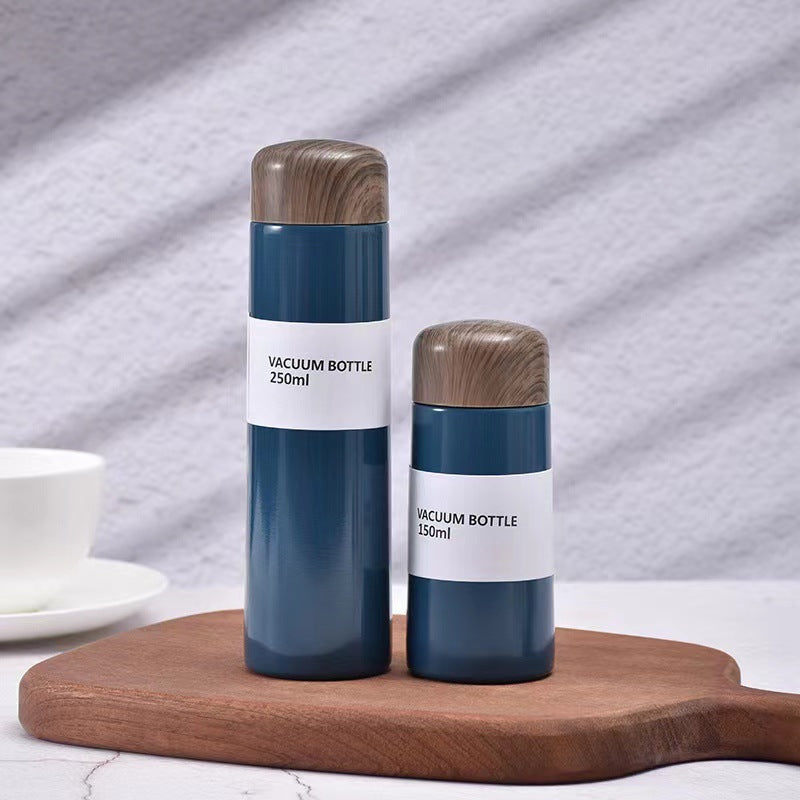 Women vacuum-insulated water bottle with innovative wooden lid Kalsten