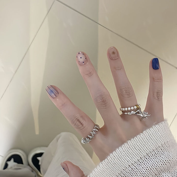 Artificial nails in modern design with geometric and sparkling accents Kalsten