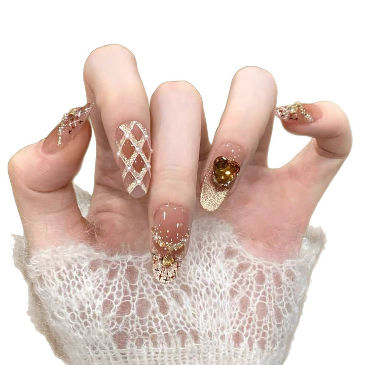 Artificial nails with glamorous gold accents Kalsten