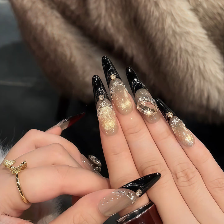 Glamorous artificial nails with extravagant rhinestone and glitter insets Kalsten