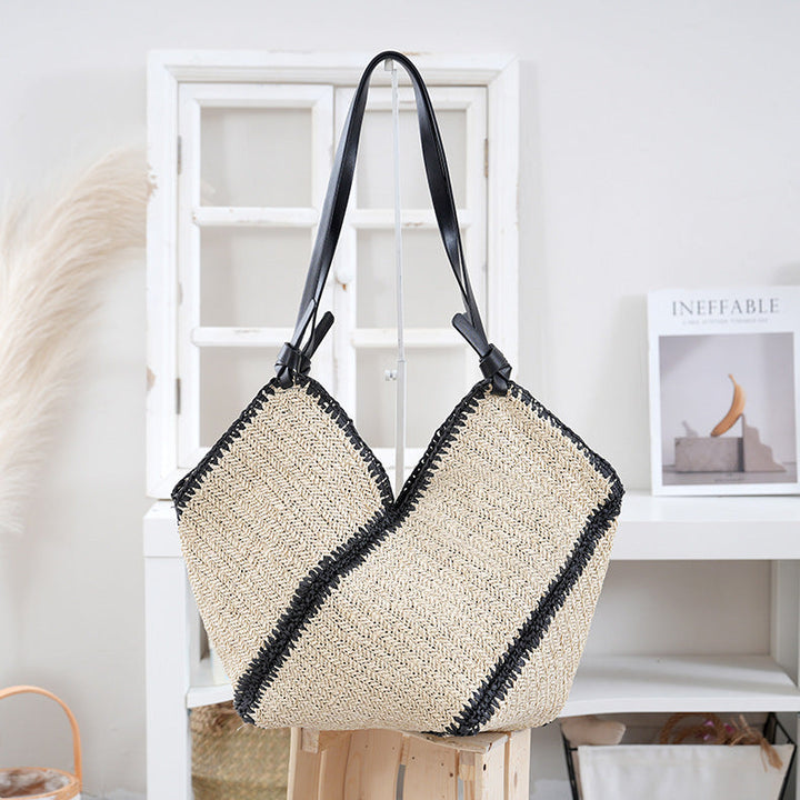 Handbag made of braided natural material with contrasting leather handles Kalsten