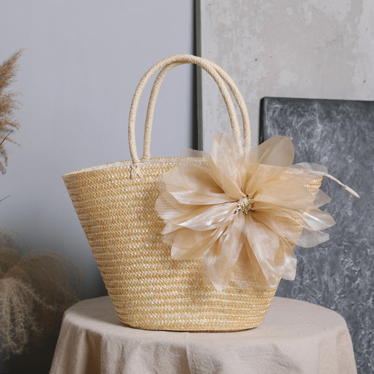 Stylish basket bag with eye-catching flower detail Kalsten