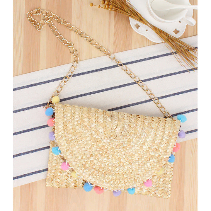 Clutch Bag Made of Handwoven Straw with Decorative Pompons Kalsten
