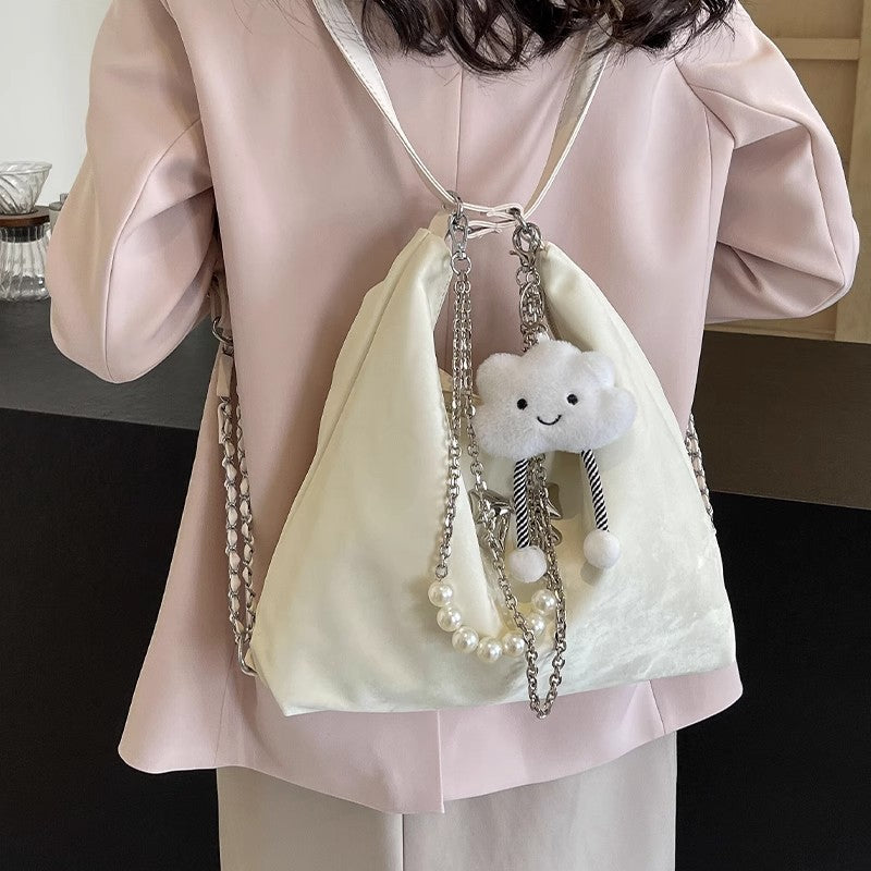 Fashionable handbag with unique pendant and chain accents Kalsten