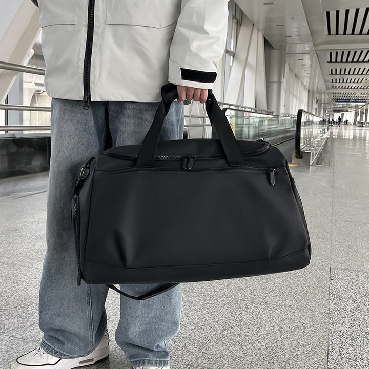 Sporty travel bag with reinforced carrying handles and multiple compartments Kalsten